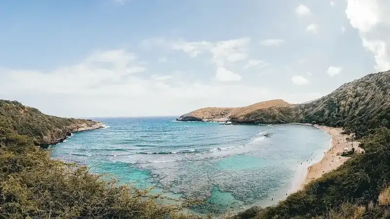 hanauma Bay near Hawaii Kai seen from the ridge, with turquoise reef water inside a curved crater bay